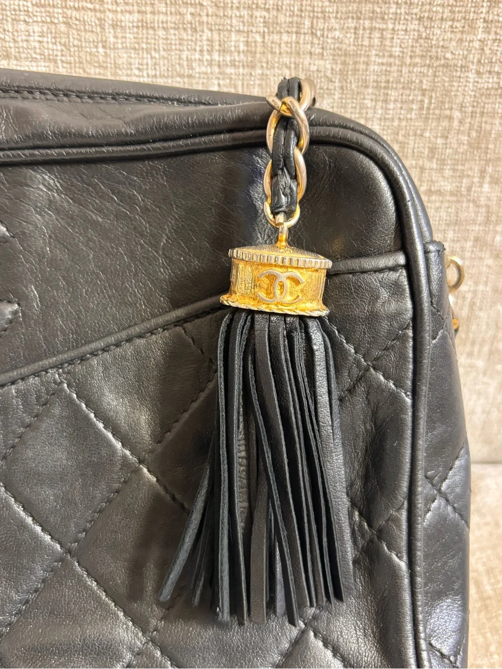 Authentic CHANEL vintage black lambskin tassel camera bag